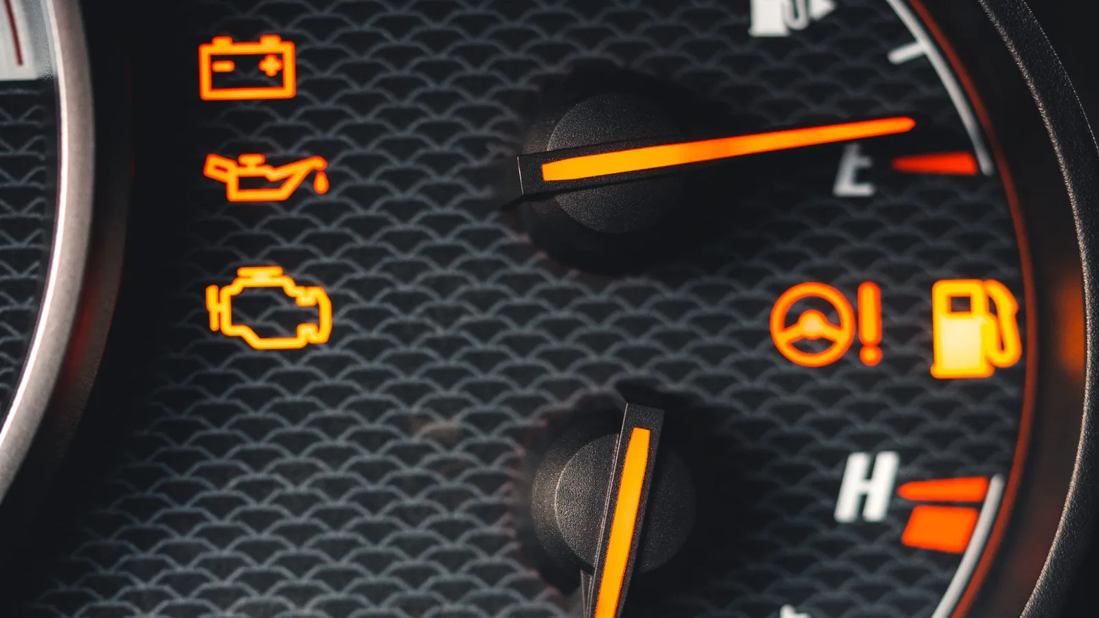 Amber warning lamps lit across an instrument cluster, the engine-management light among them